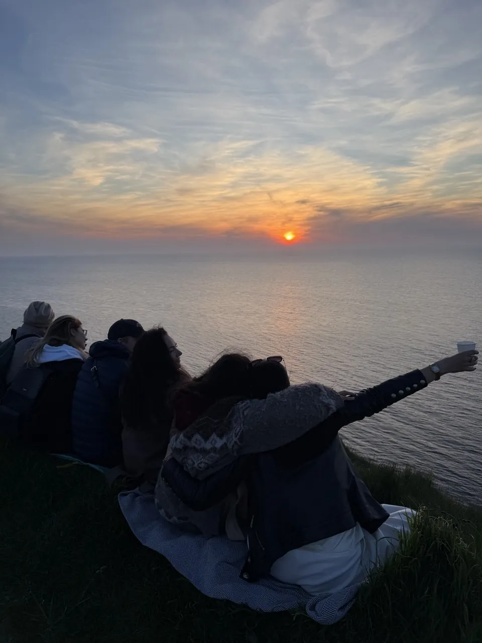 ProTours guests watching sunset above the Normandy coast