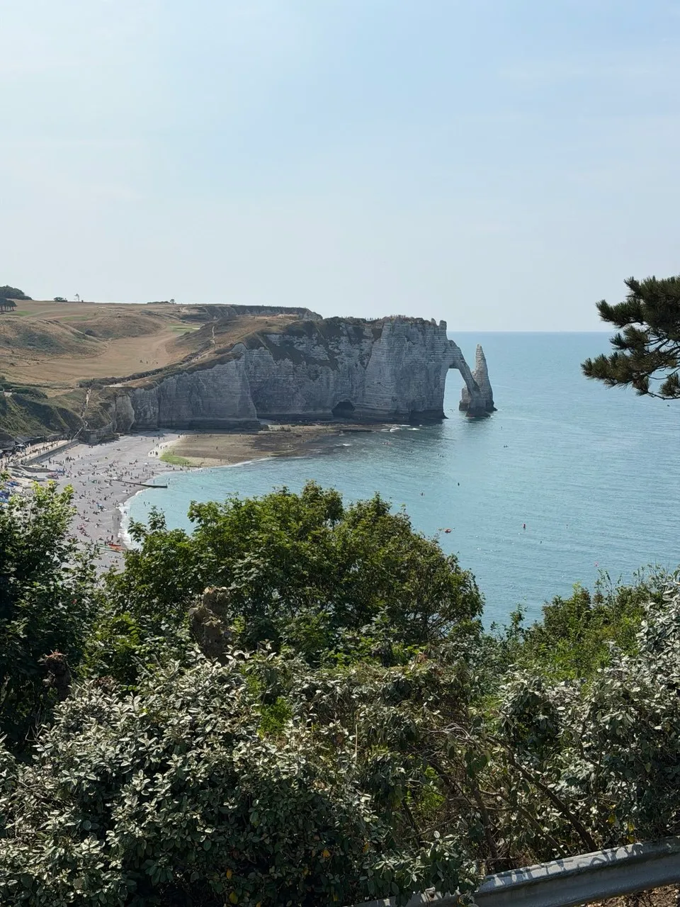 A panoramic view of the Étretat arch from the gardens above town