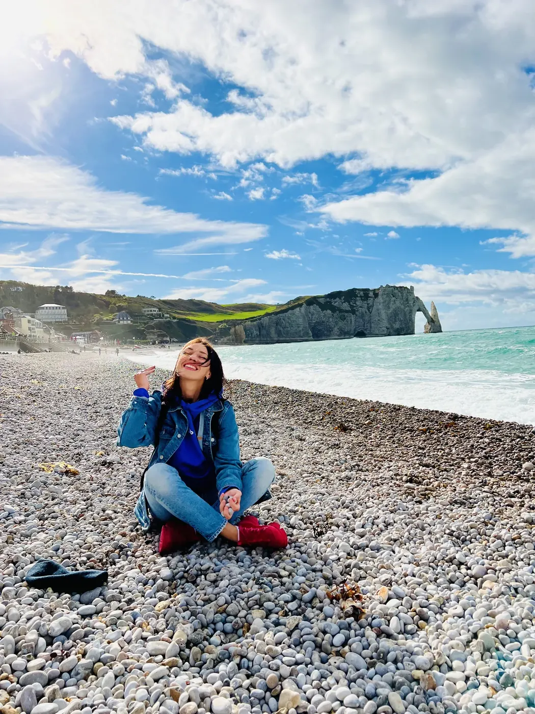 A smiling ProTours guest on the pebble beach in Étretat